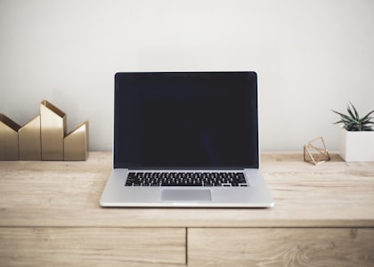 Axiom Labs platform running on laptop — product photography